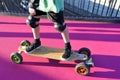 Man legs rides on a electric skateboard